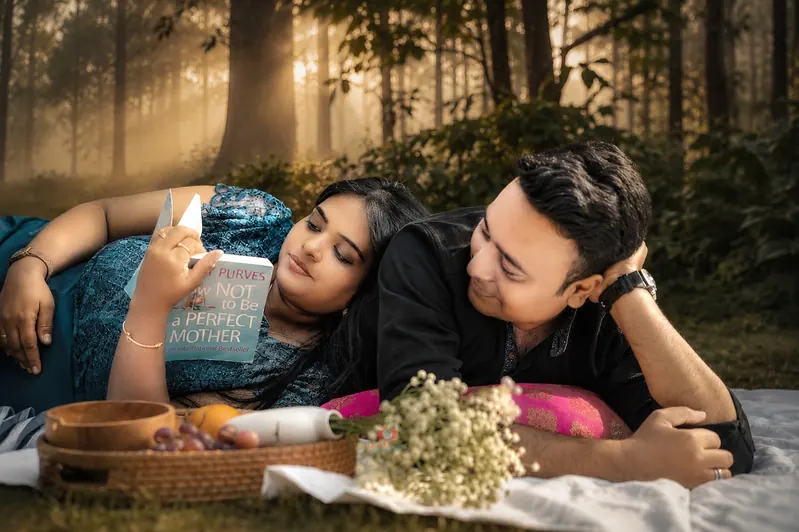 Couple pregnancy photoshoot in a forest at golden hour by Candid Clicks