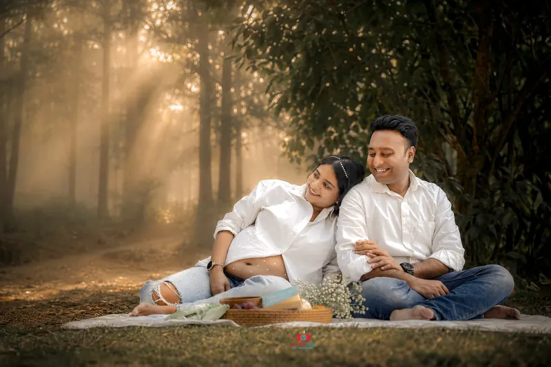 Expecting parents maternity portrait in a forest setting by Candid Clicks