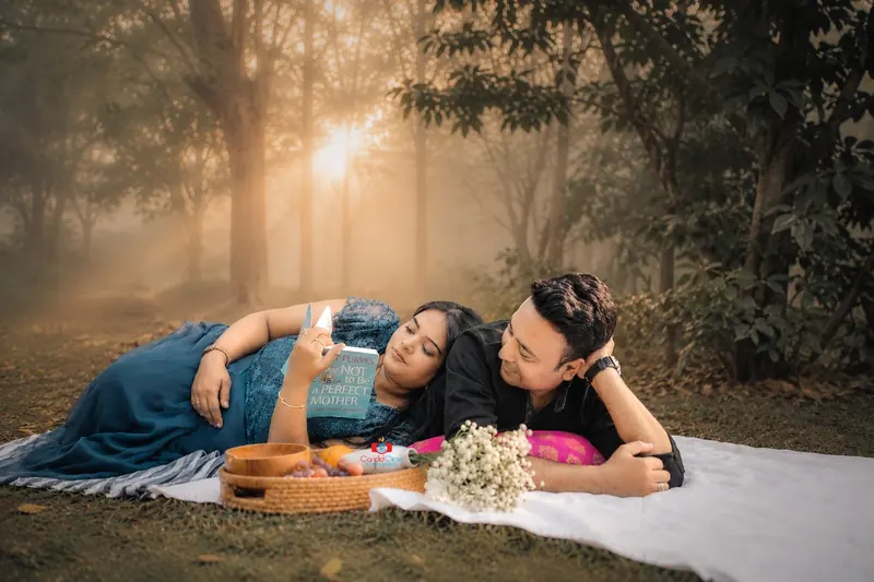 Pregnancy couple photography during an outdoor maternity session by Candid Clicks