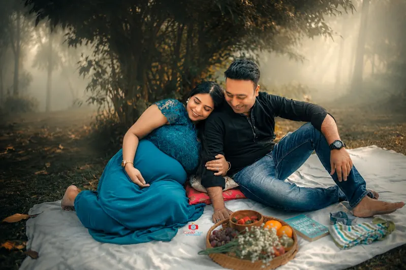Intimate maternity lifestyle portrait of expecting parents by Candid Clicks